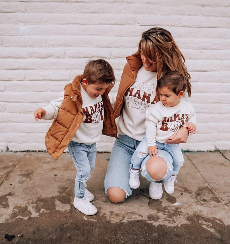 A mom and her two toddlers wearing matching tees