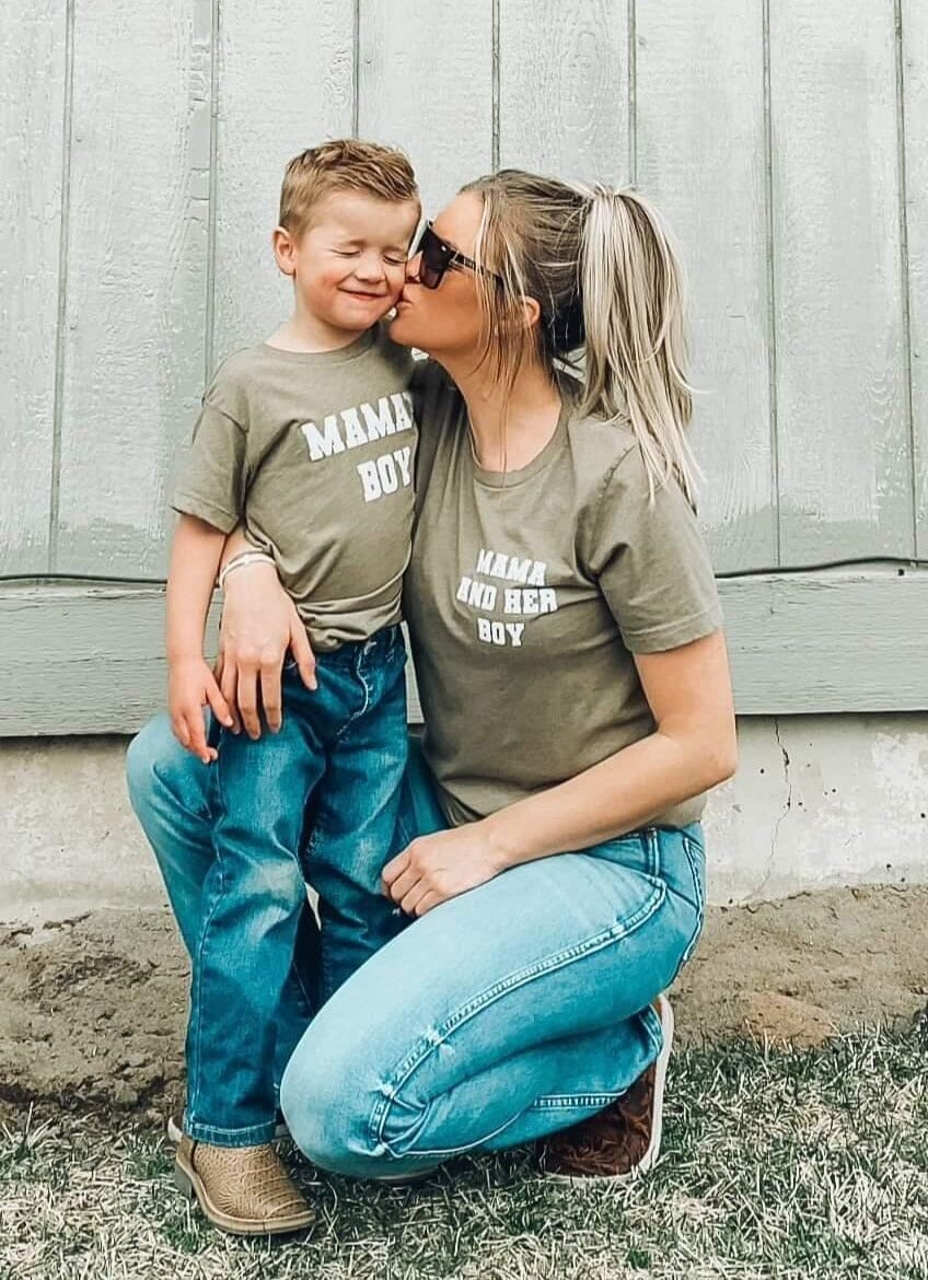A mom and son wearing a mama and her boy set of Mommy and Me shirts in green