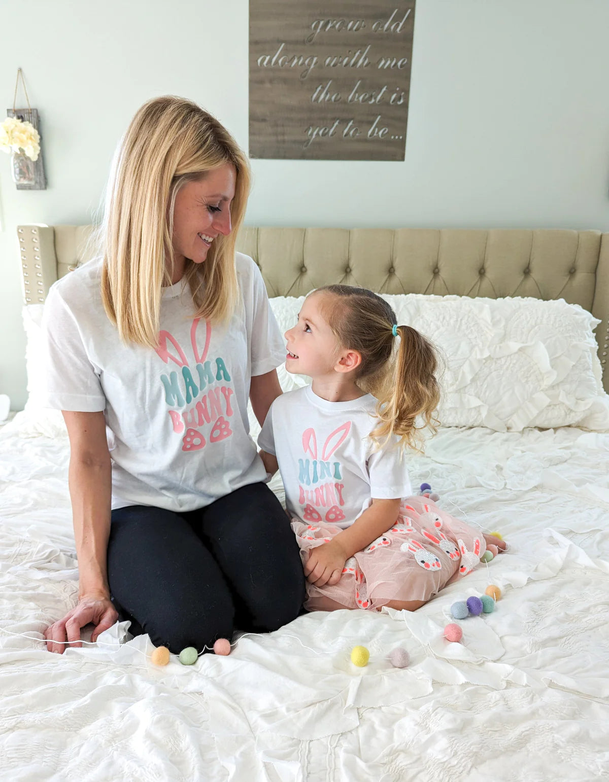 Mom and child wearing matching graphic Easter shirts