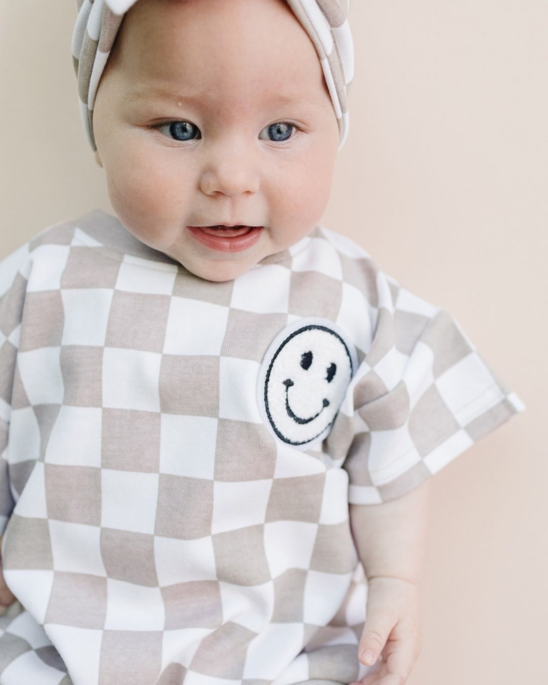 Short Sleeve Bubble Romper | Checkered Smiley Latte