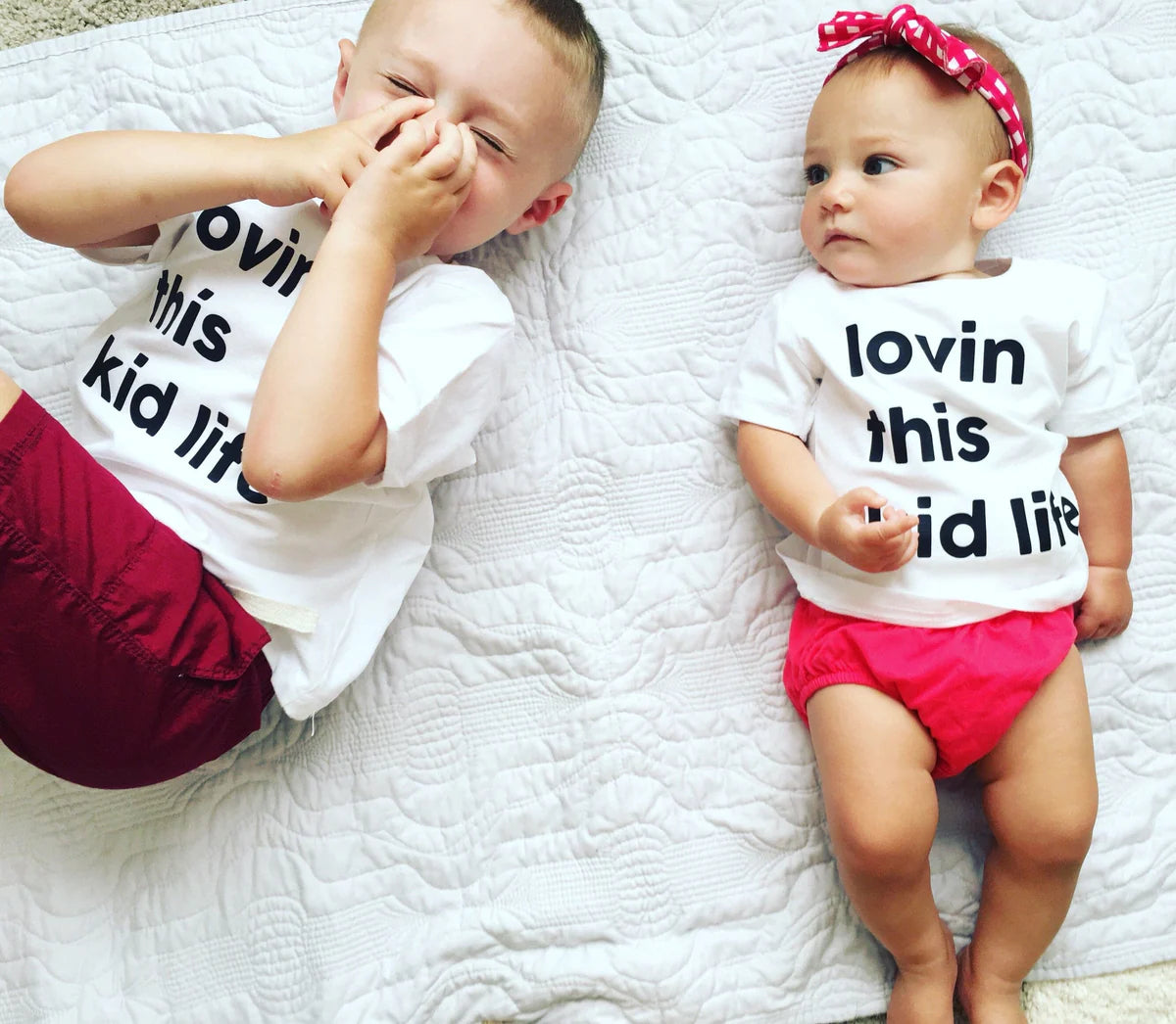 Toddler matching shirts that say, “Lovin’ this kid life”